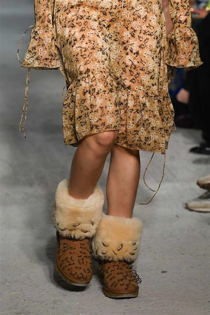 
Dua Lipa Wears Ugg Boots with Piercings — See Her Edgy Look 